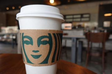 MIAMI, FLORIDA - JUNE 11: A Starbucks coffee cup sits on a table as the company reported supply shortages at some coffee shops on June 11, 2021 in Miami, Florida. The coffee chain said it had supply shortages for some items due to problems in the supply chain. (Photo by Joe Raedle/Getty Images)